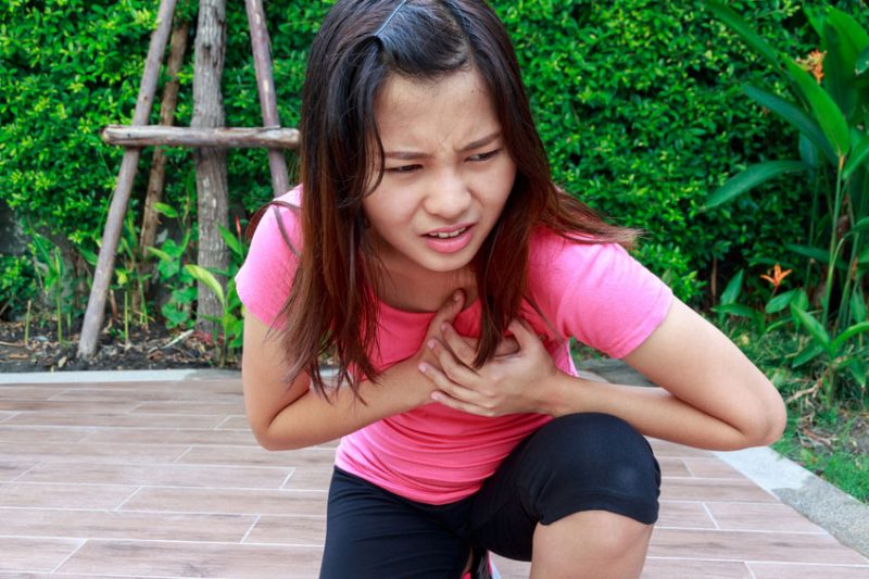 Sporty woman having heart attack - Angina Pectoris, Myocardial Infarction.